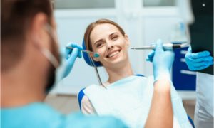 The dentist explains the difference between amalgam vs. composite resin.
